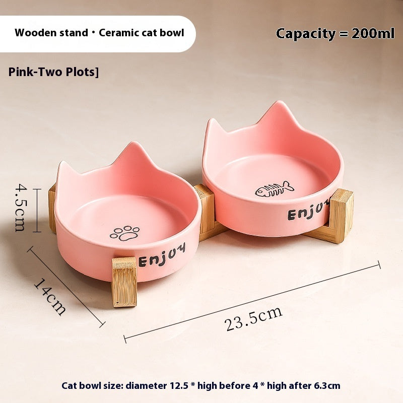 Deux gamelles surélevées en céramique rose avec supports en bois pour chat