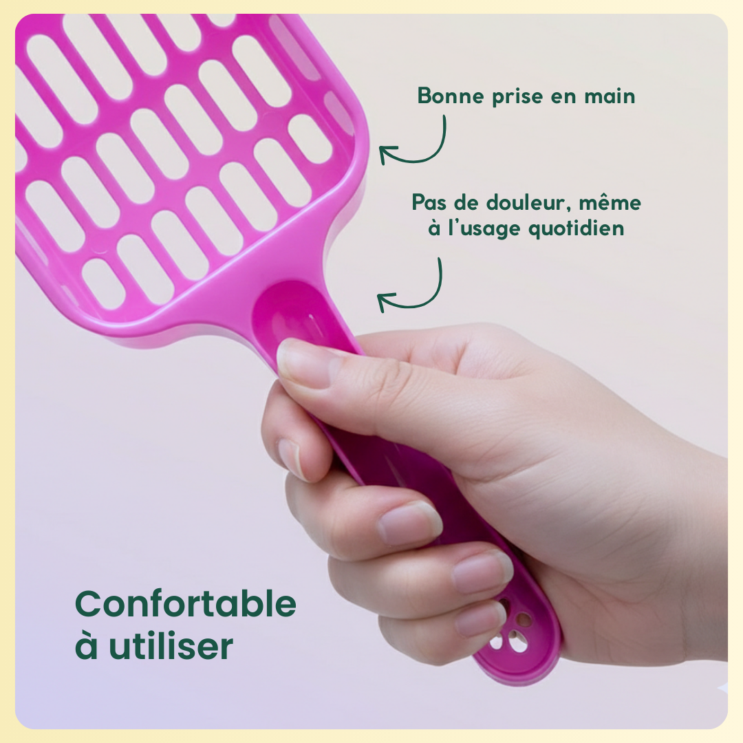 Pelle à litière rose tenue en main avec poignée ergonomique